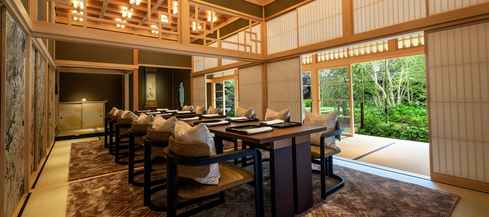 SHIKI-NO-MA: the cypress room with its coffered ceiling, the long laid table and the sliding doors open onto the garden.