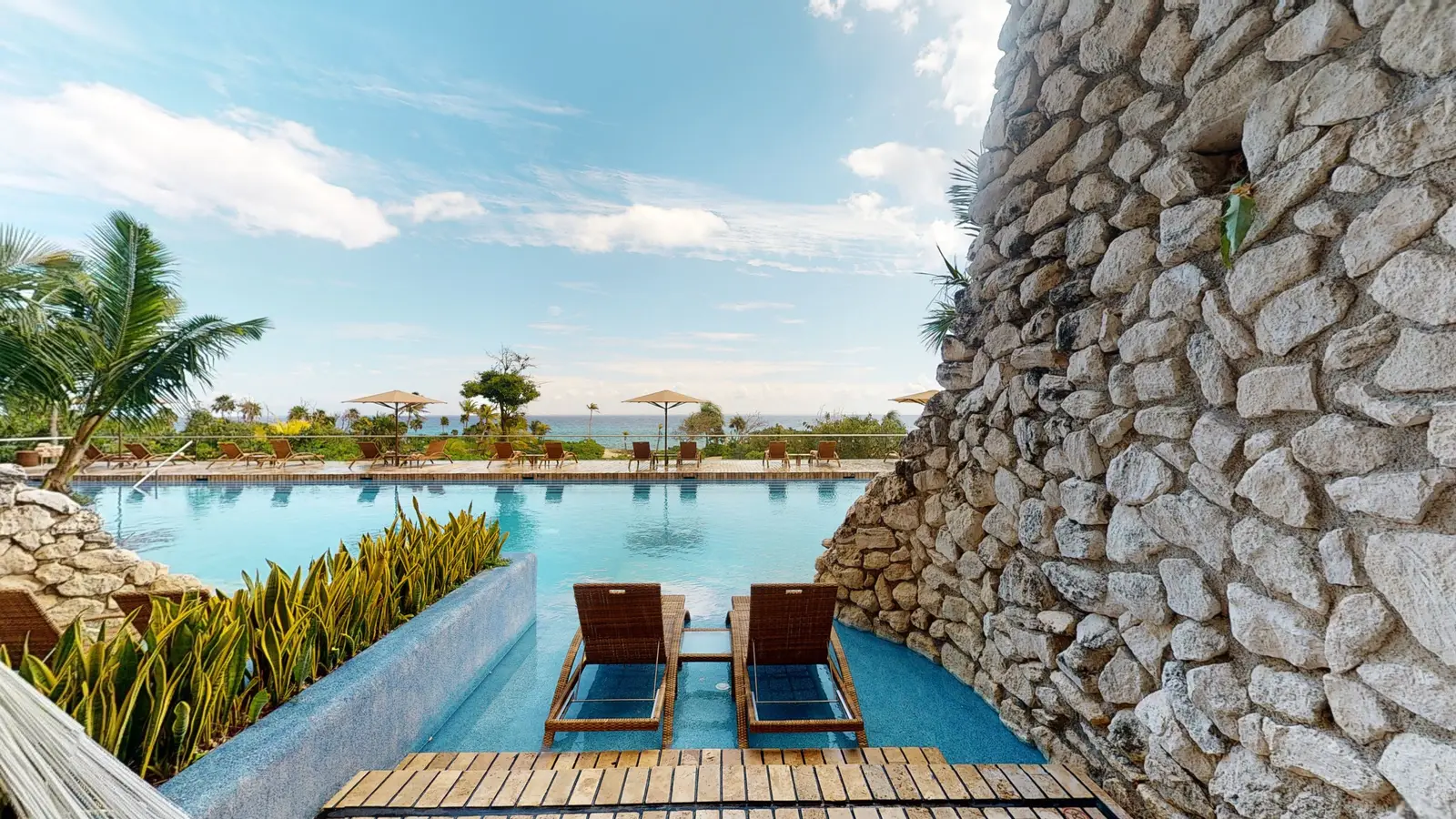 Pool access from the Adults Ocean Front Swim Up, with in-water loungers