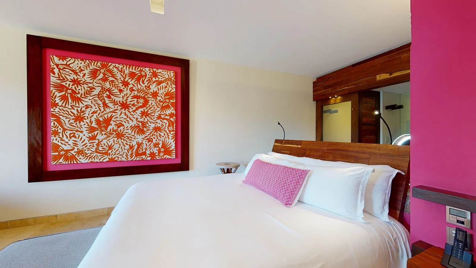 Garden Suite bedroom with a pink and orange decorative panel