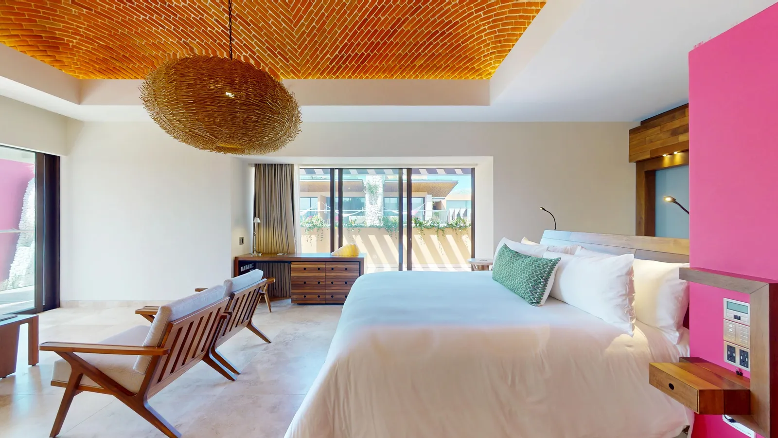 Master Suite with bed, chairs and a brick ceiling