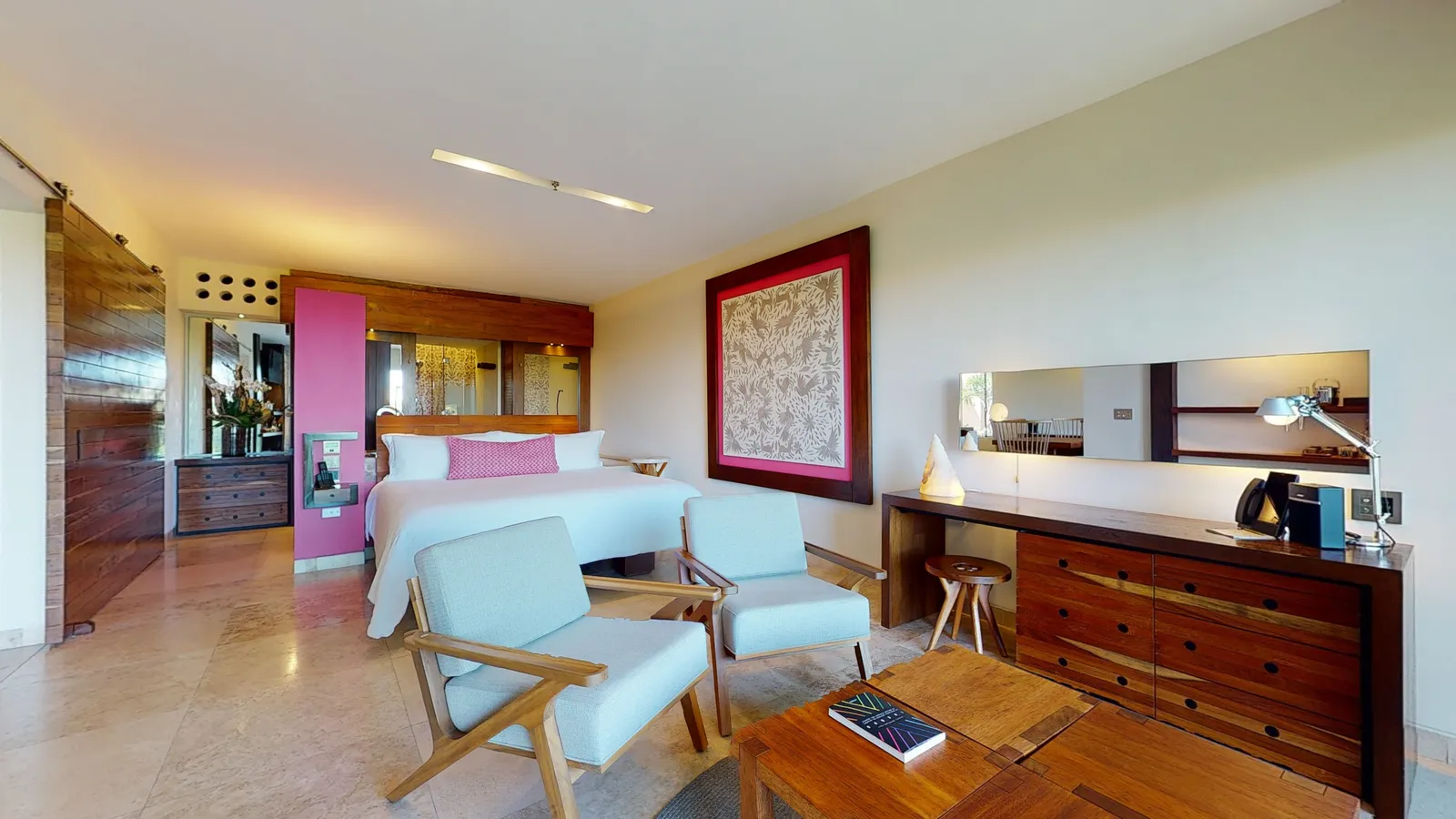 Spa Junior Suite with bed, chairs and timber furniture