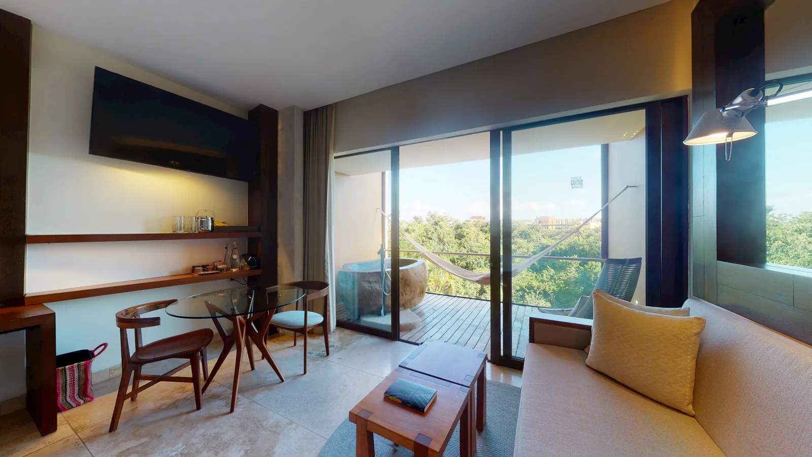 River Spa Suite seating area and terrace with an outdoor tub