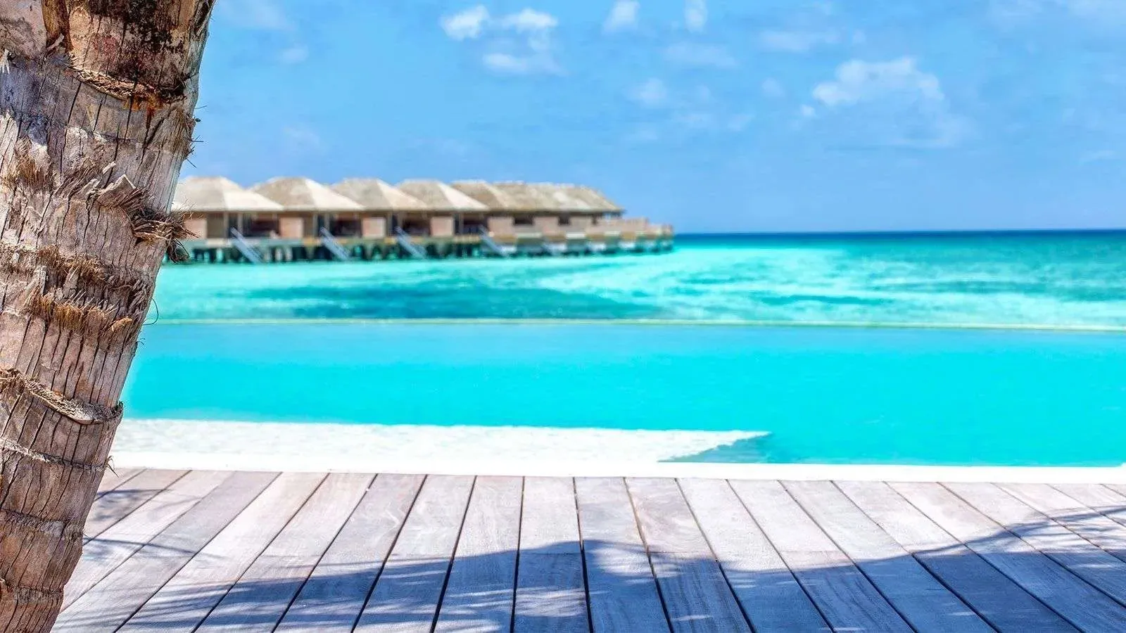 The Coco Bar deck with the infinity pool and the lagoon