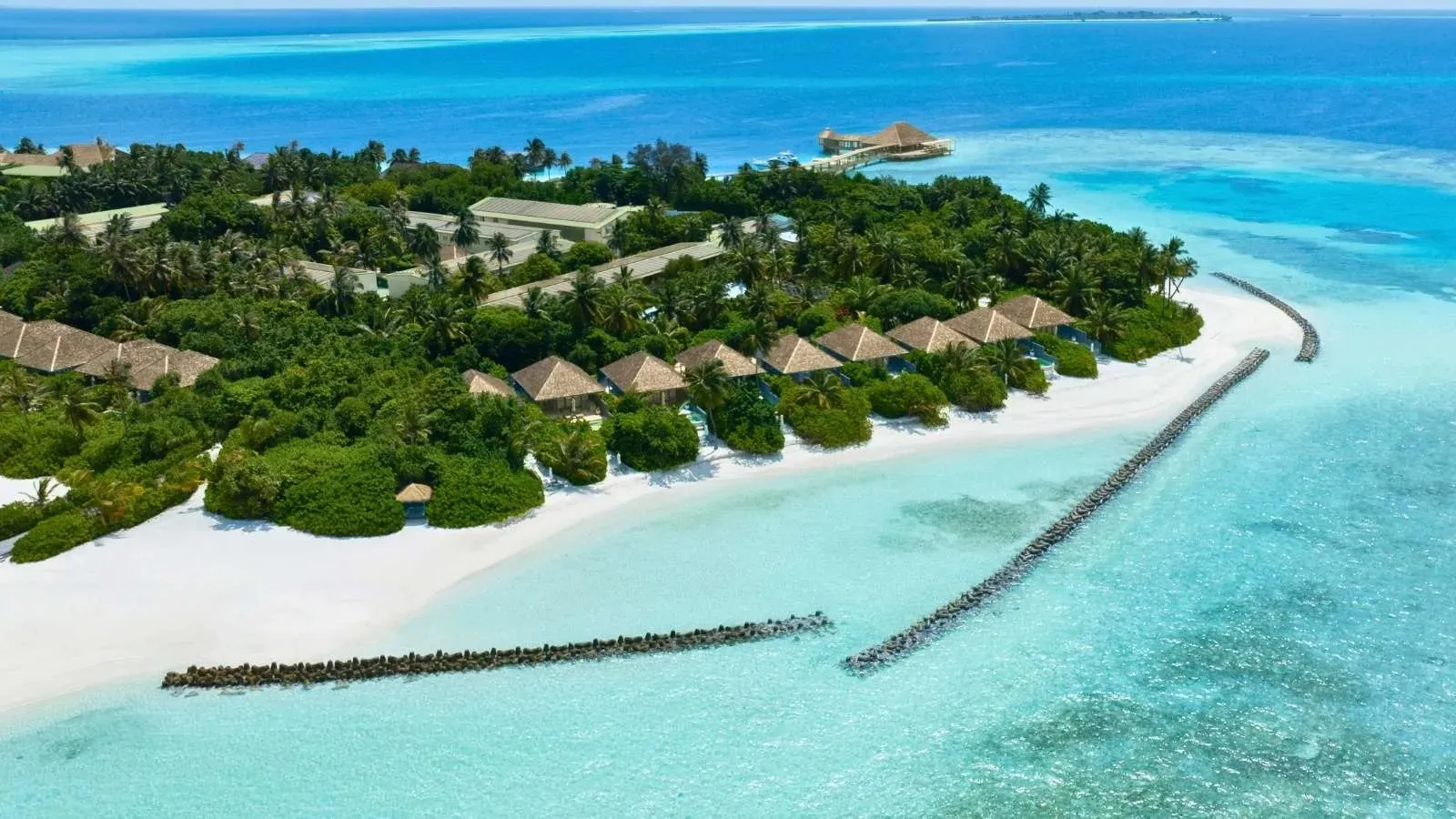 The island from the air with its beach, lagoon and jetty