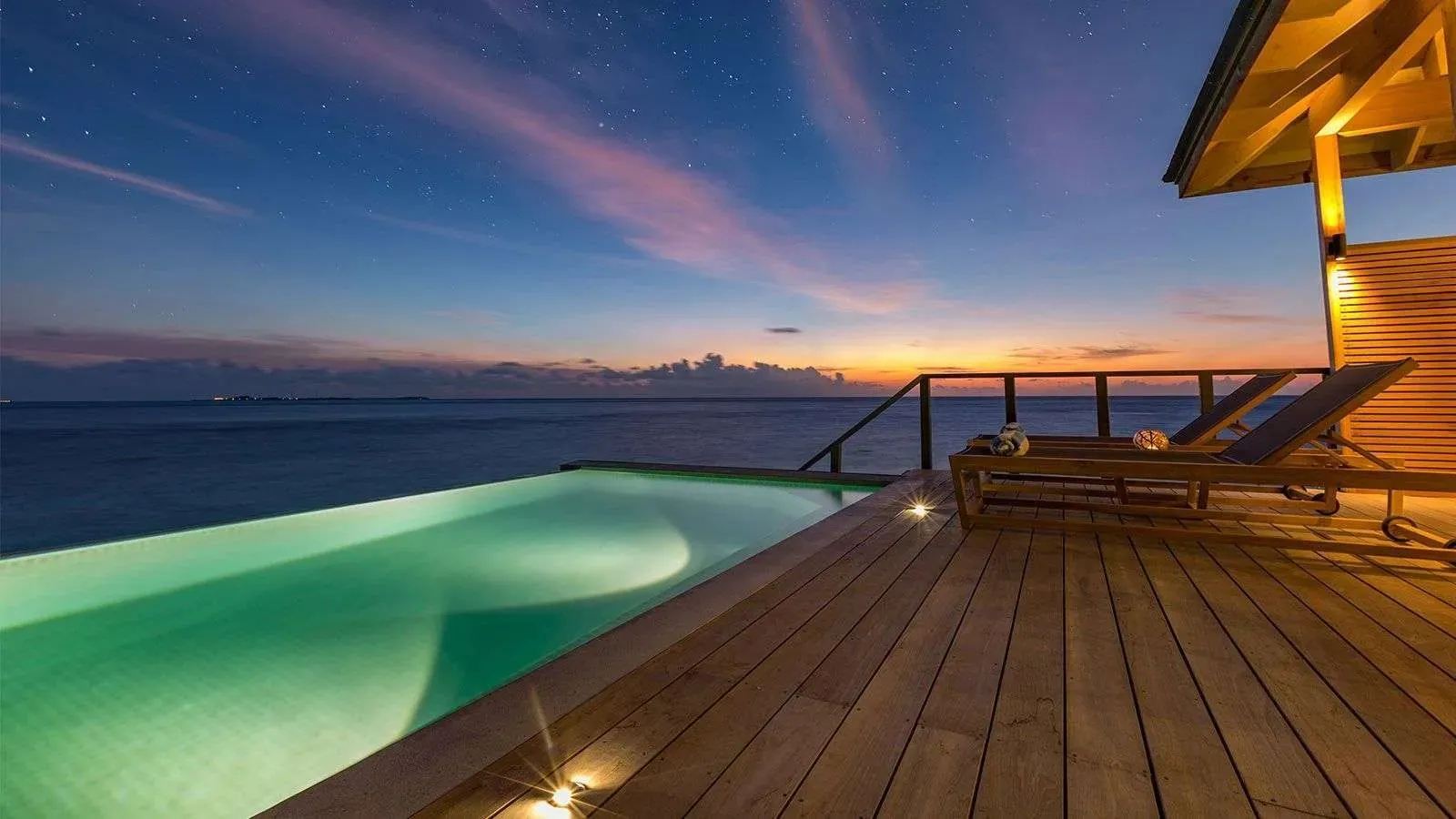 An Ocean Pool Villa’s infinity pool at sunset