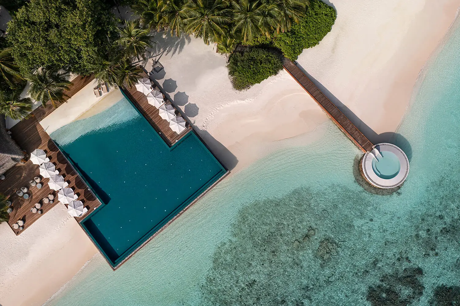 The pool and the reef from above, with the jetty out to sea