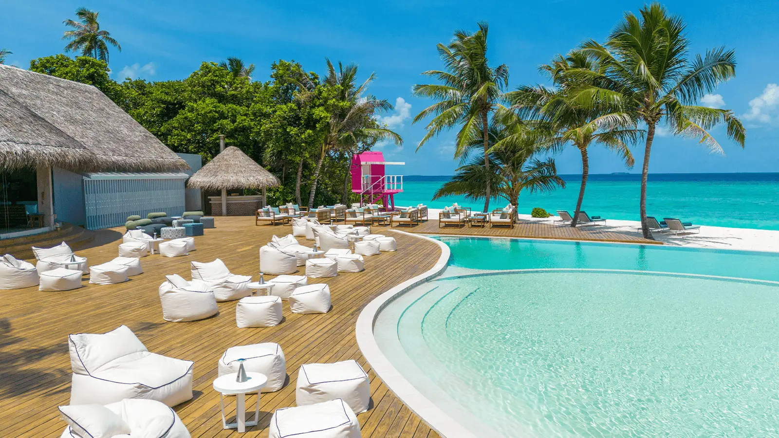 The pool with loungers and parasols.