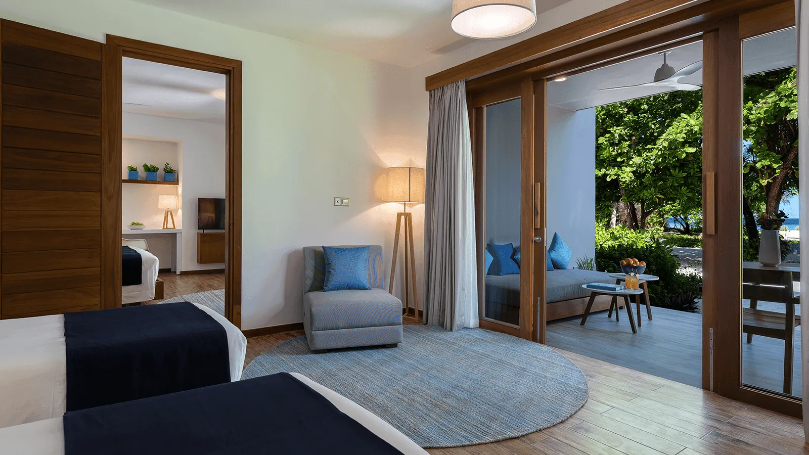 A room with 2 beds shown in the Family 4 Bedroom Nest gallery.