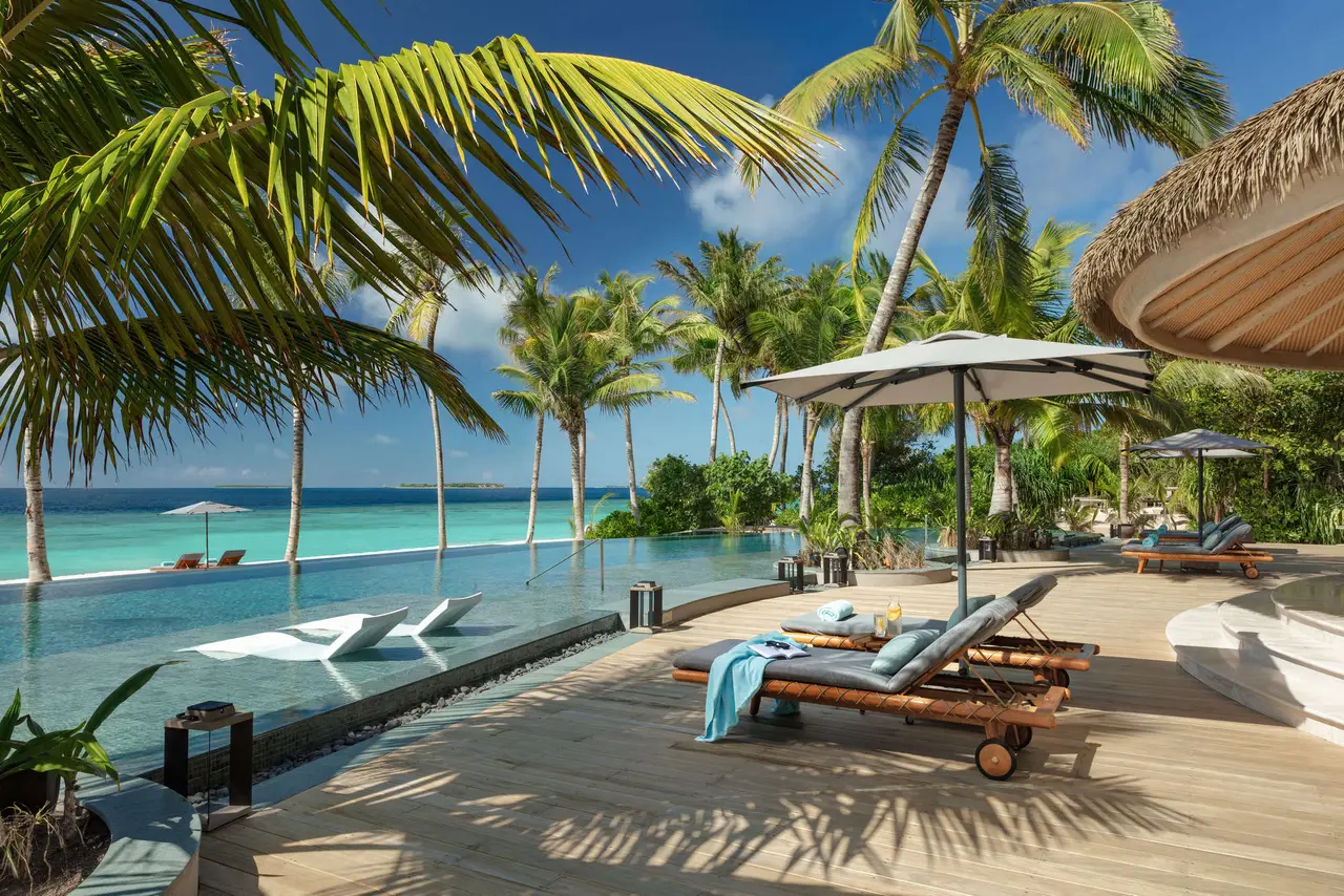 MOJO’s terrace on the beach, loungers and a parasol