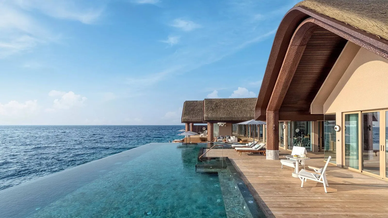 The Four Bedroom Private Wellbeing Ocean Pool Residence’s infinity pool over the water