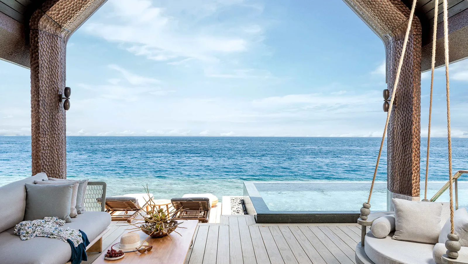 A Grand Two Bedroom Ocean Pool Villa’s deck, with its swing