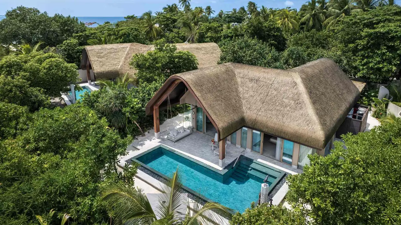 A Grand Beach Pool Villa from the air, its pool in the greenery