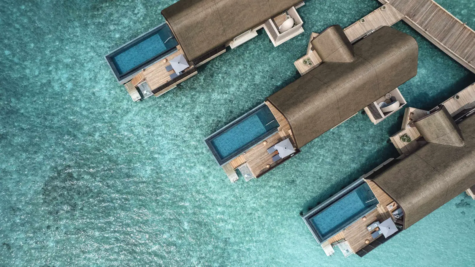 3 Ocean Pool Villas from the air, each with a pool on its deck