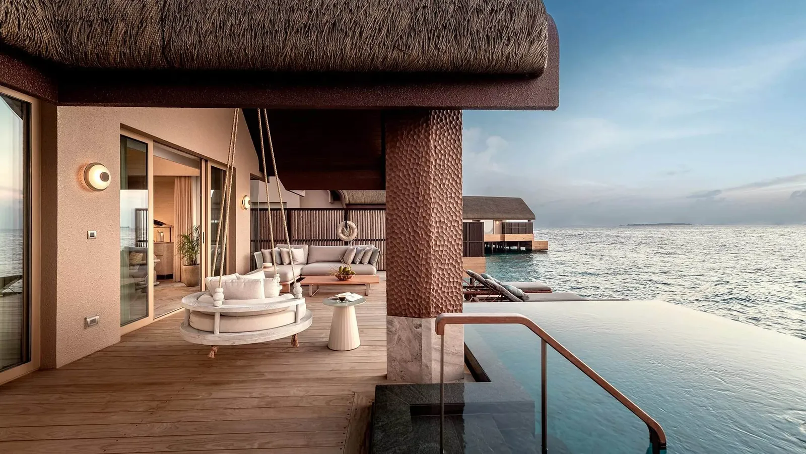 A Sunset Grand Ocean Pool Villa’s deck, the sea beyond the pool