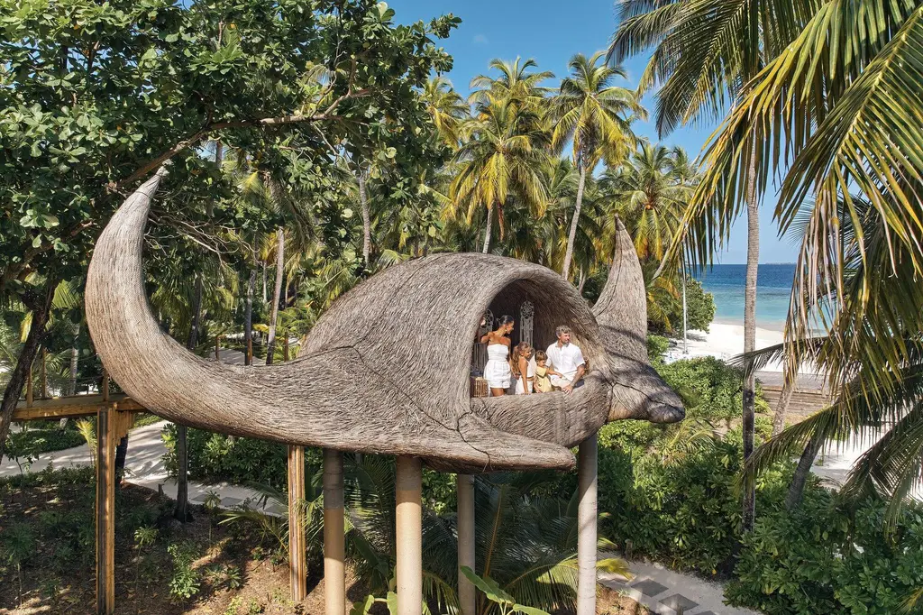 The Manta Treehouse, the manta-shaped tree house, among the palms