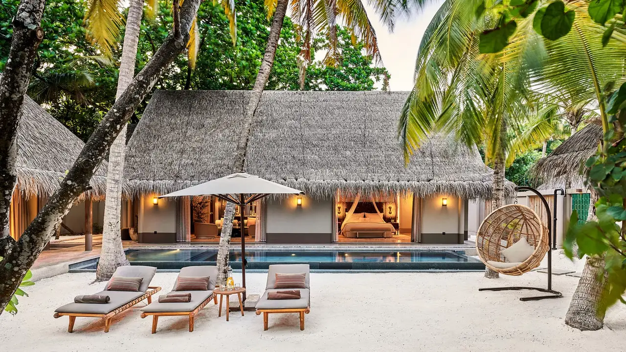 A 2-bedroom beach villa, its pool and loungers