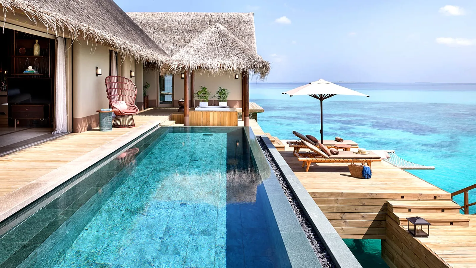 The Three Bedroom Ocean Residence’s long pool, over the water