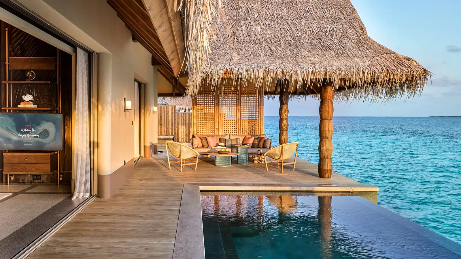 A Luxury Water Villa with Pool, its infinity pool before the sitting room