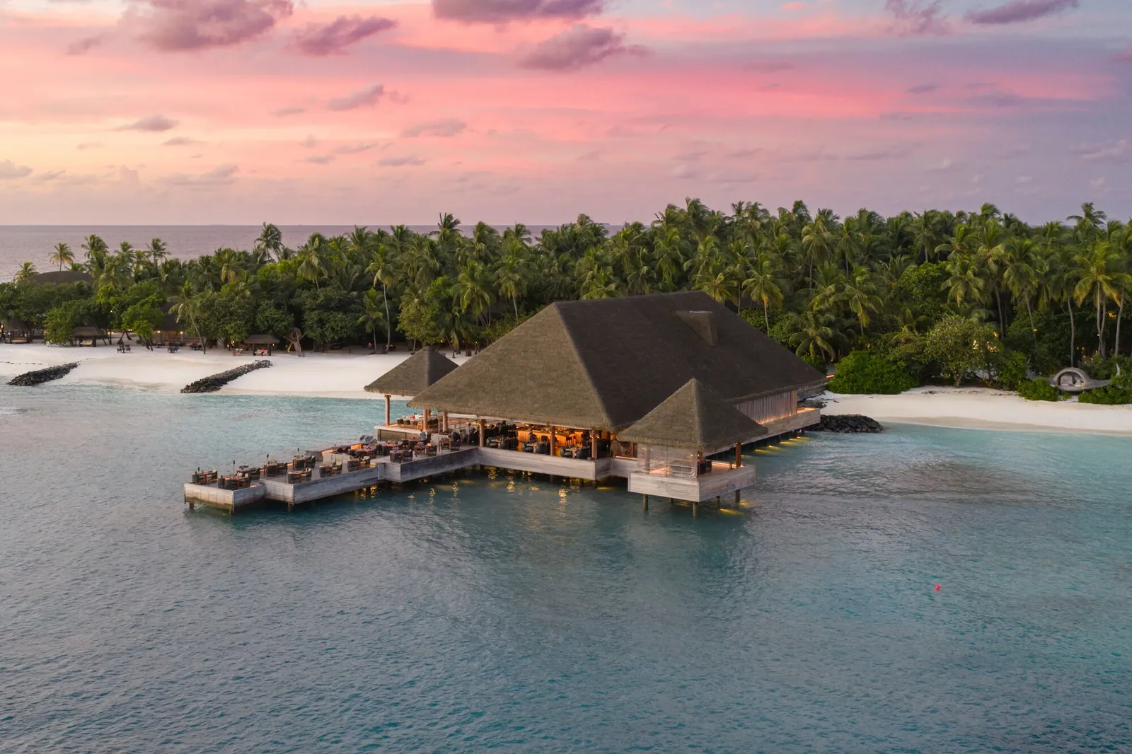 Saoke from the air, over the water off the island, at sunset