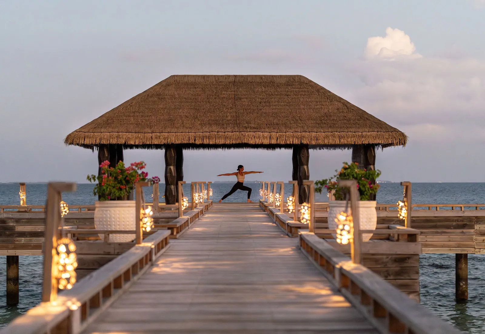 The yoga pavilion at the end of its jetty, at sunset