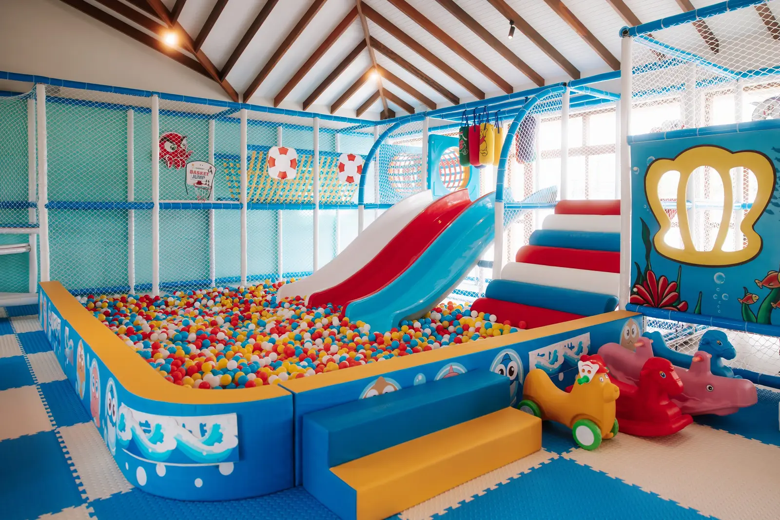 Kiddie Cove’s playroom with the ball pit and the slide