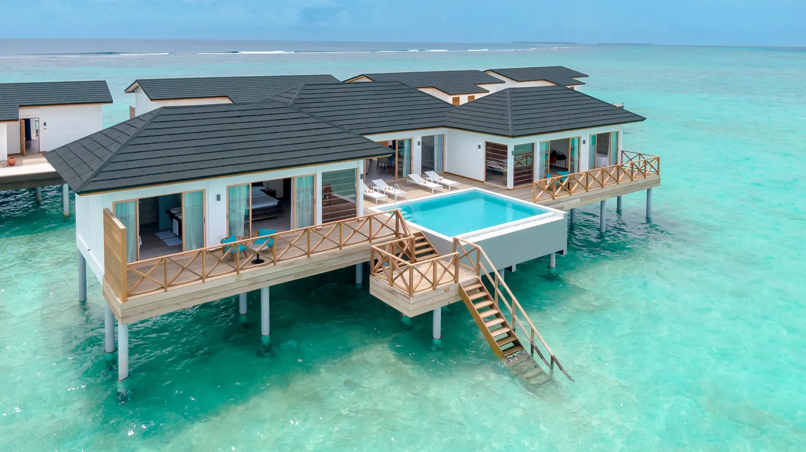 The Lagoon Residence on stilts, its pool on the deck and the ladder down to the lagoon