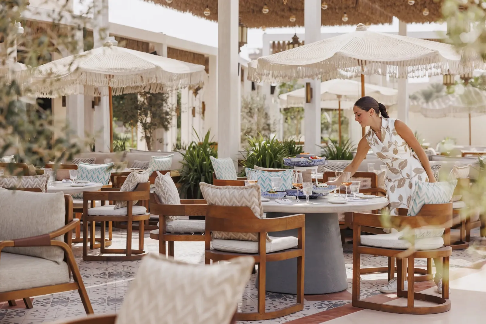 Nuska Beach’s terrace with wooden chairs and parasols