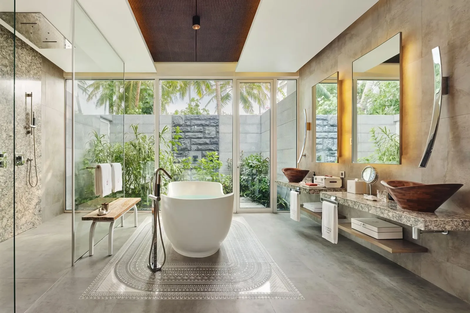 The Beach Villa bathroom: the freestanding tub, the stone basins and the shower open to the garden