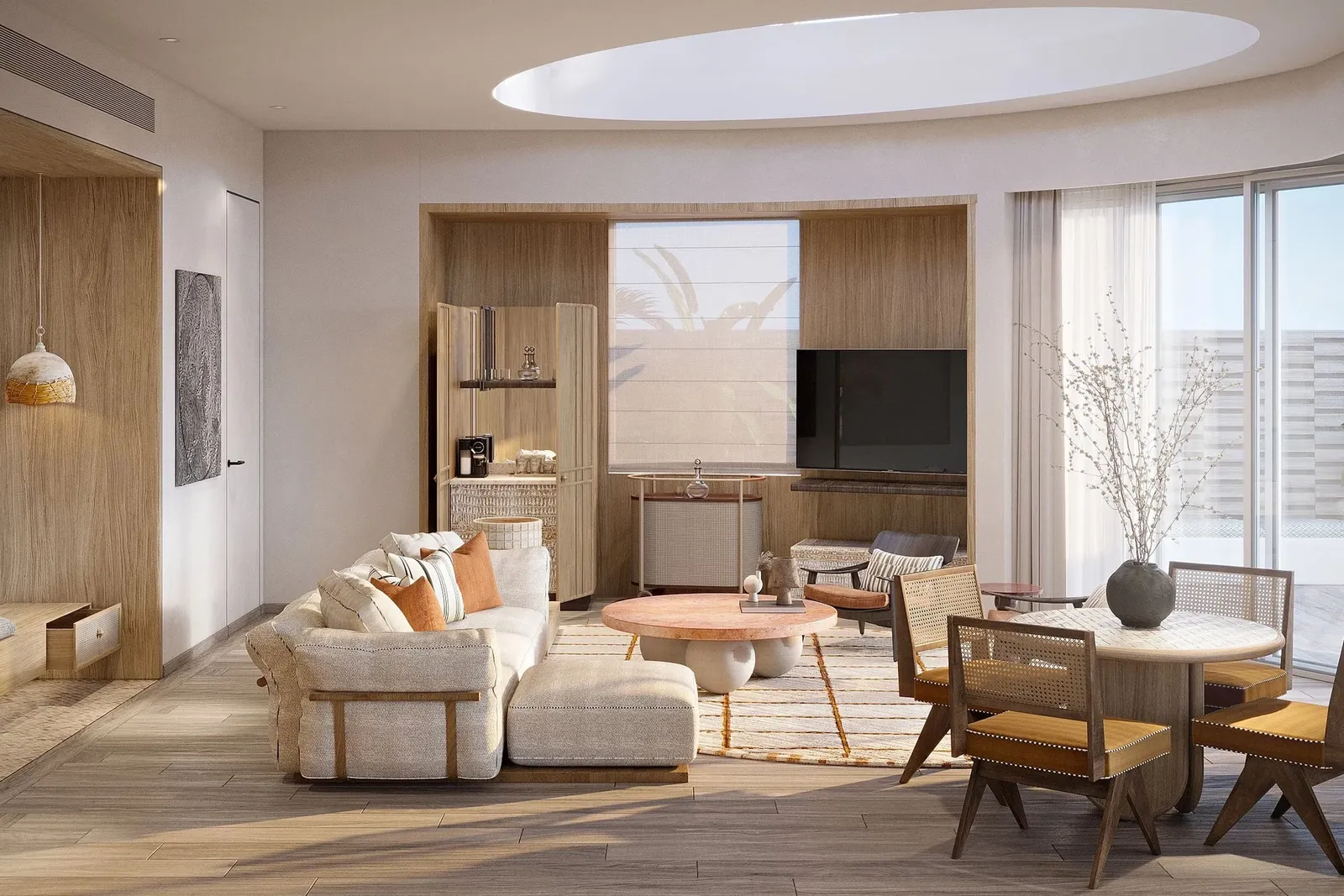 The Grand Lagoon Villa living room, with its round skylight, kitchenette and dining table