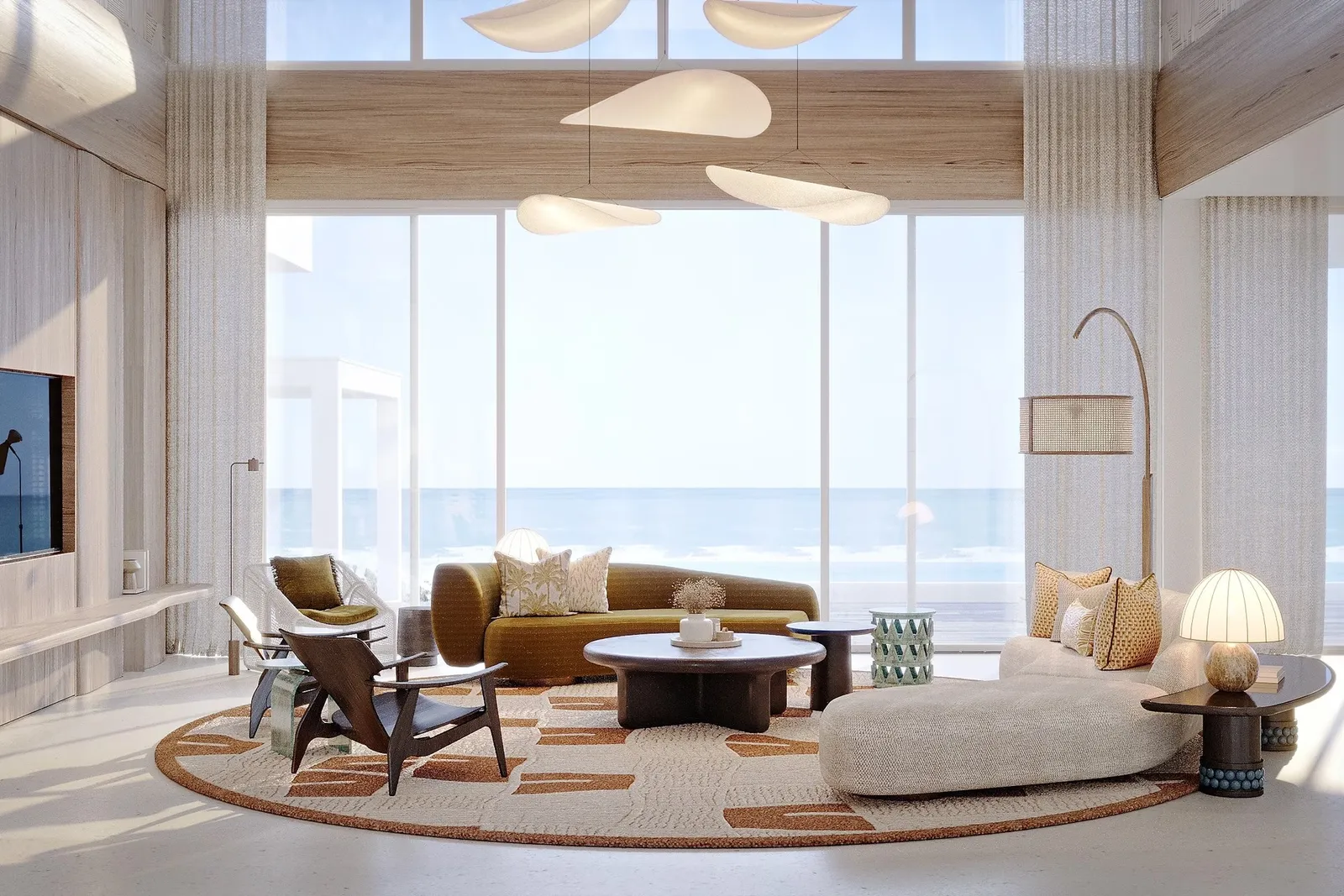 A retreat’s double-height living room, low sofas and the sea beyond the windows