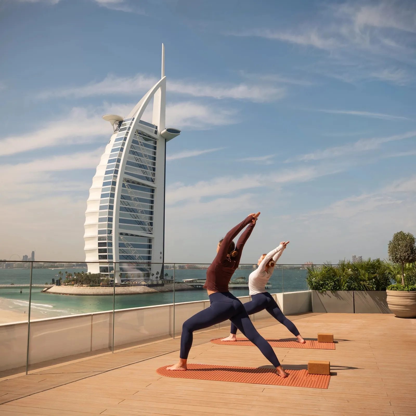 Yoga on a terrace facing the Burj Al Arab