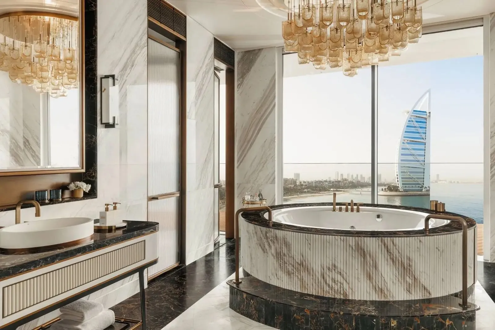 A round marble bath facing the Burj Al Arab