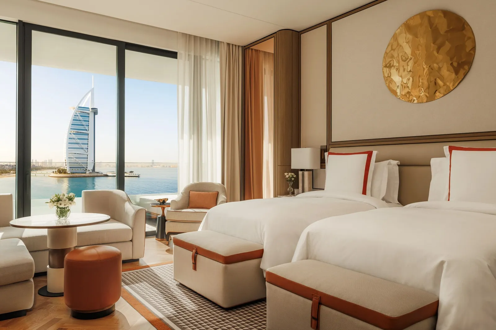 A twin room with the Burj Al Arab beyond the glass
