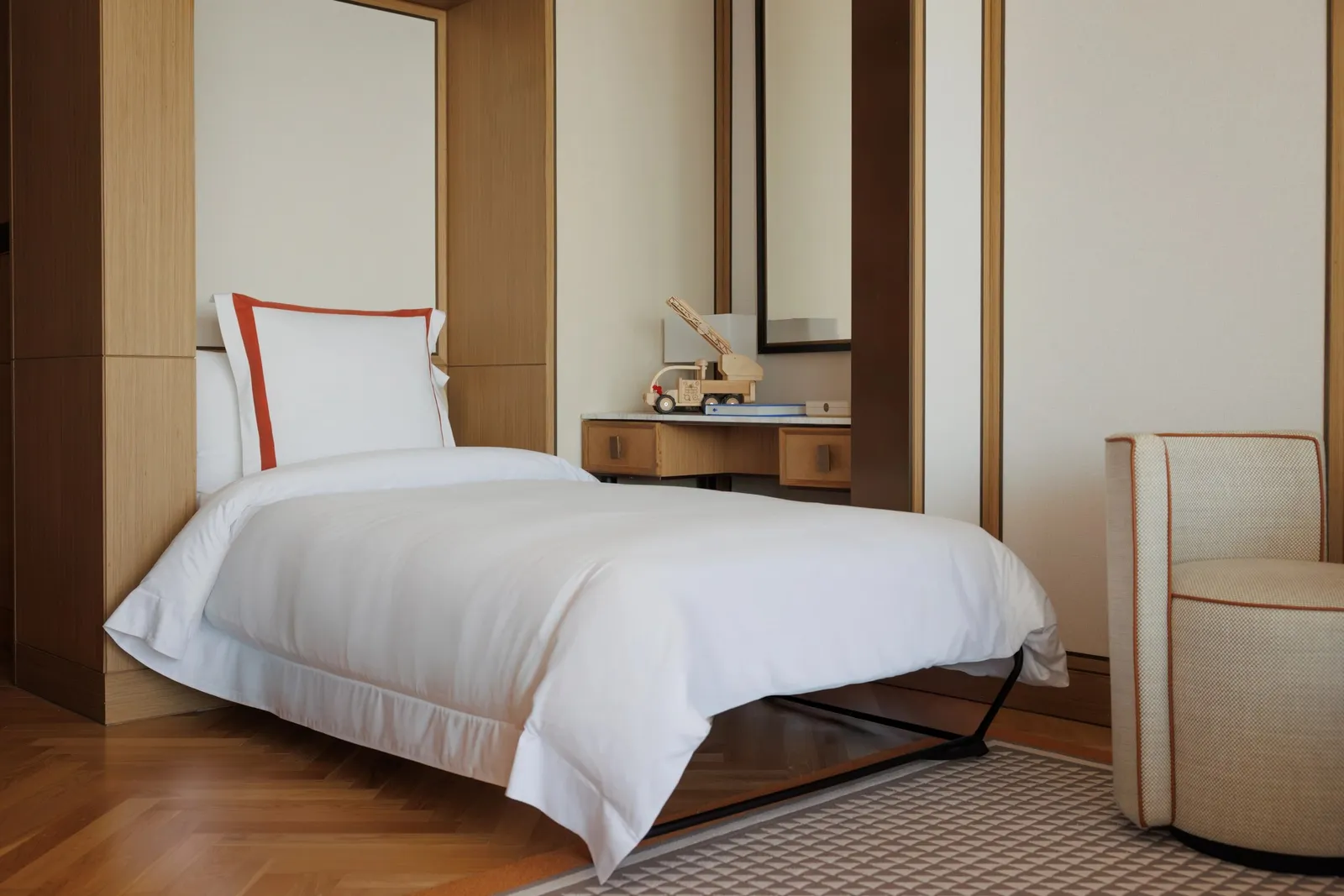 The Murphy bed folded down beside an armchair