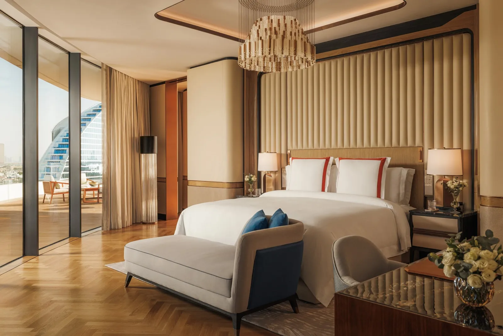 A bedroom with the Burj Al Arab’s sail behind it