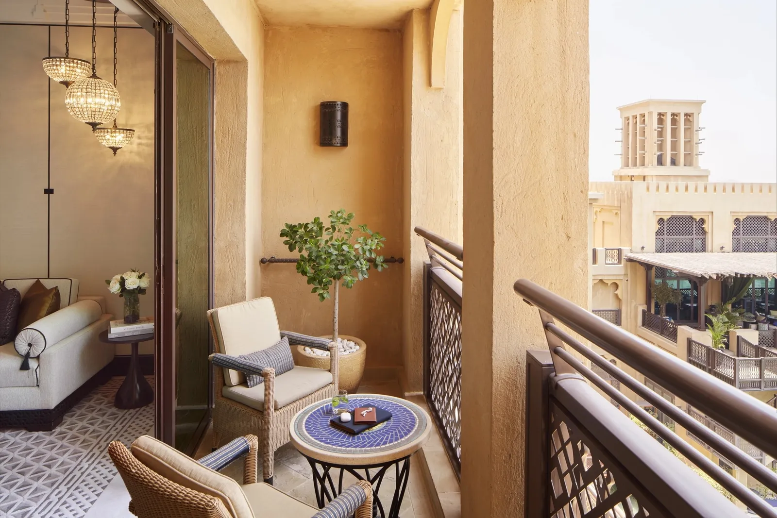 Armchairs and a table on the Deluxe Lagoon balcony