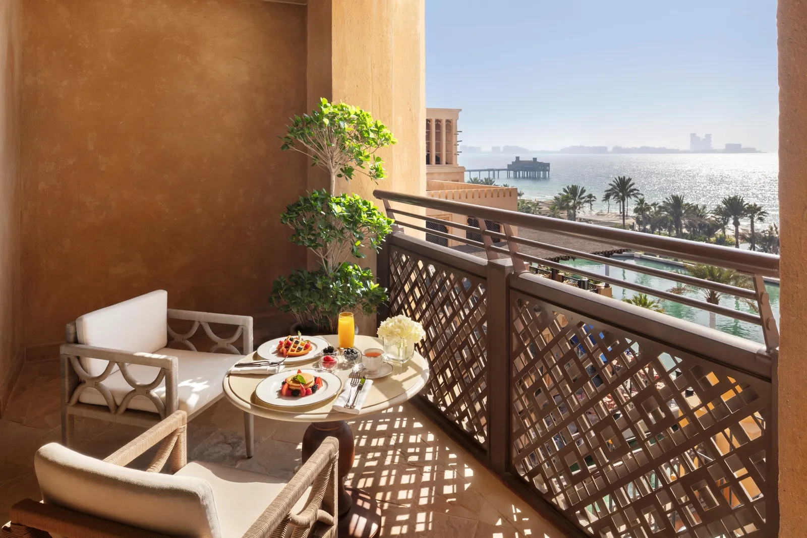 Breakfast on the balcony of the One-Bedroom Deluxe Ocean Suite