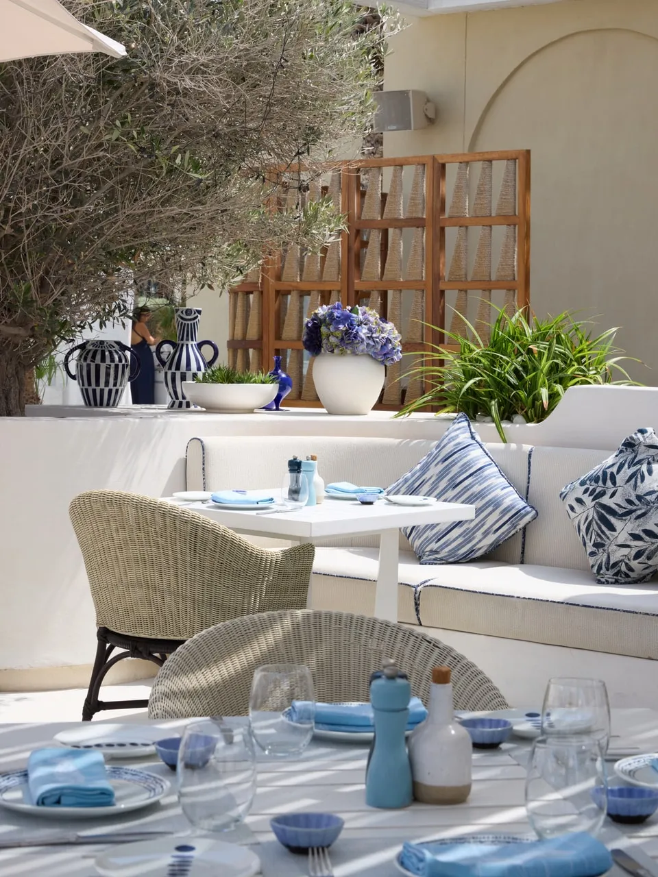 Laid tables and woven chairs at Shimmers