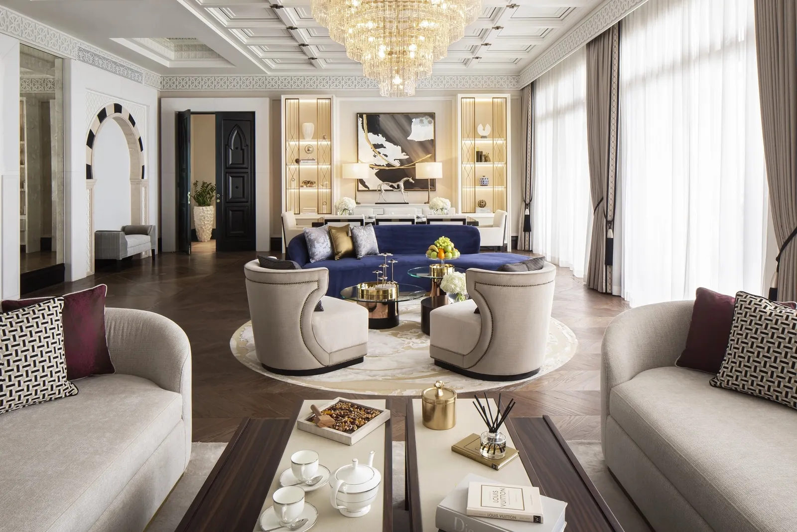 The pale living rooms of the Royal Suite with tables and armchairs