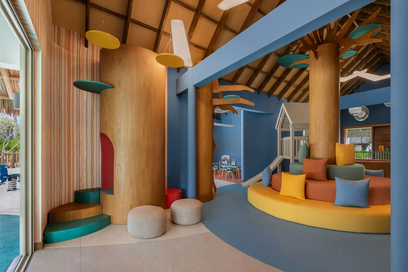 Inside the kids’ club, the treehouse and coloured cushions