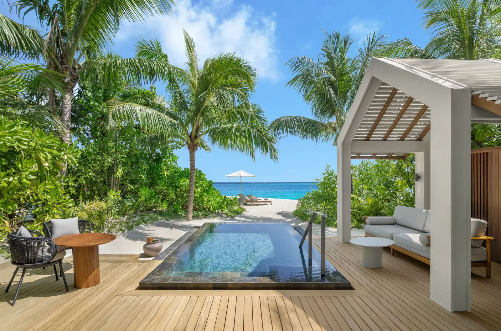 A Beach Pool Villa’s pool and gazebo, the beach beyond the palms