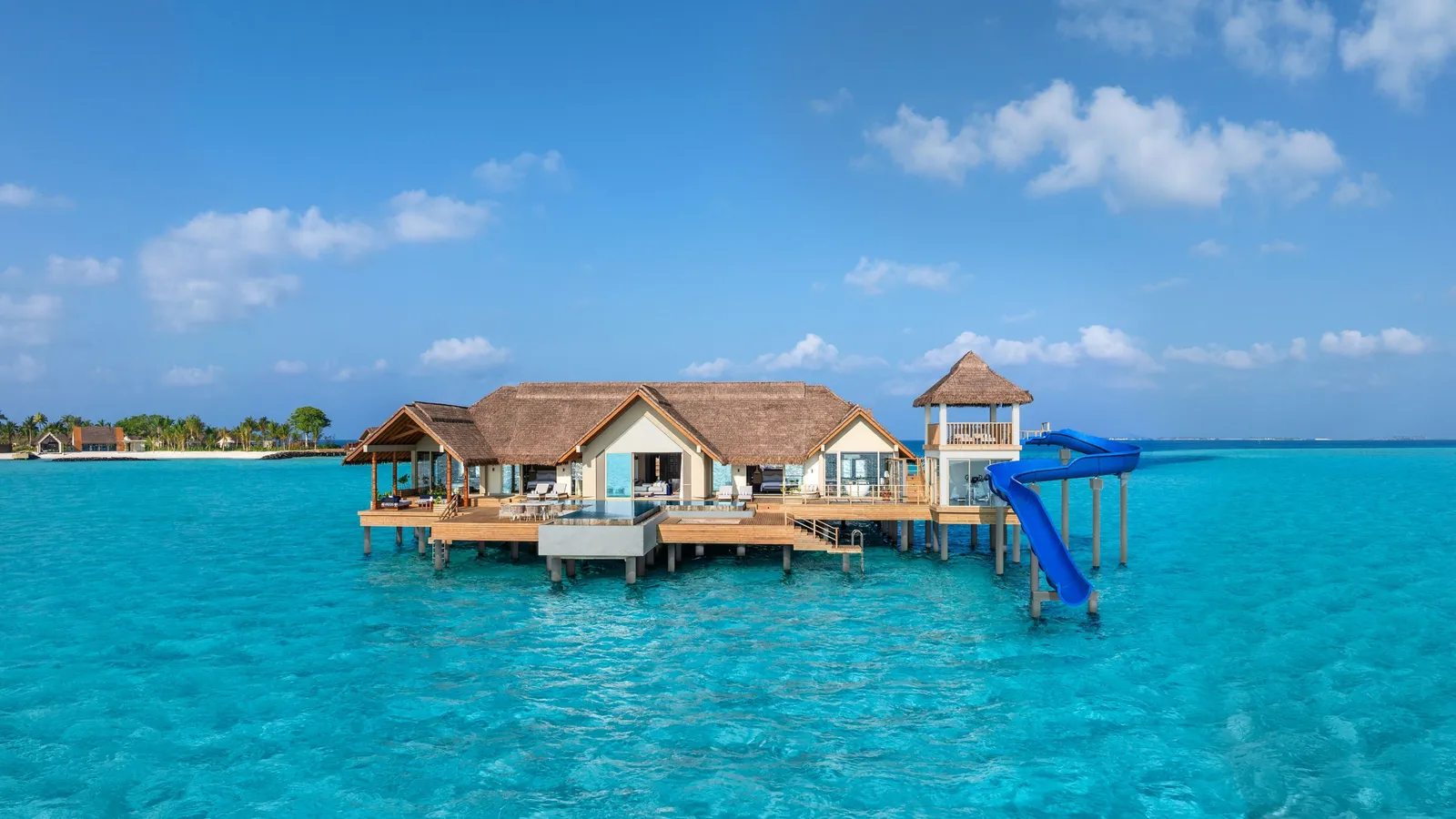 The Ocean Residence over the water, its slide down into the lagoon