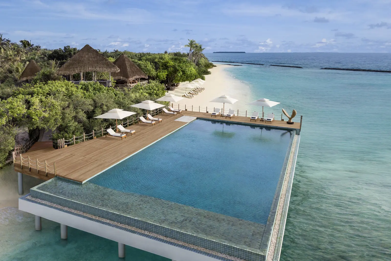 Pool 18, the adults-only infinity pool, loungers on its deck and the beach beside it