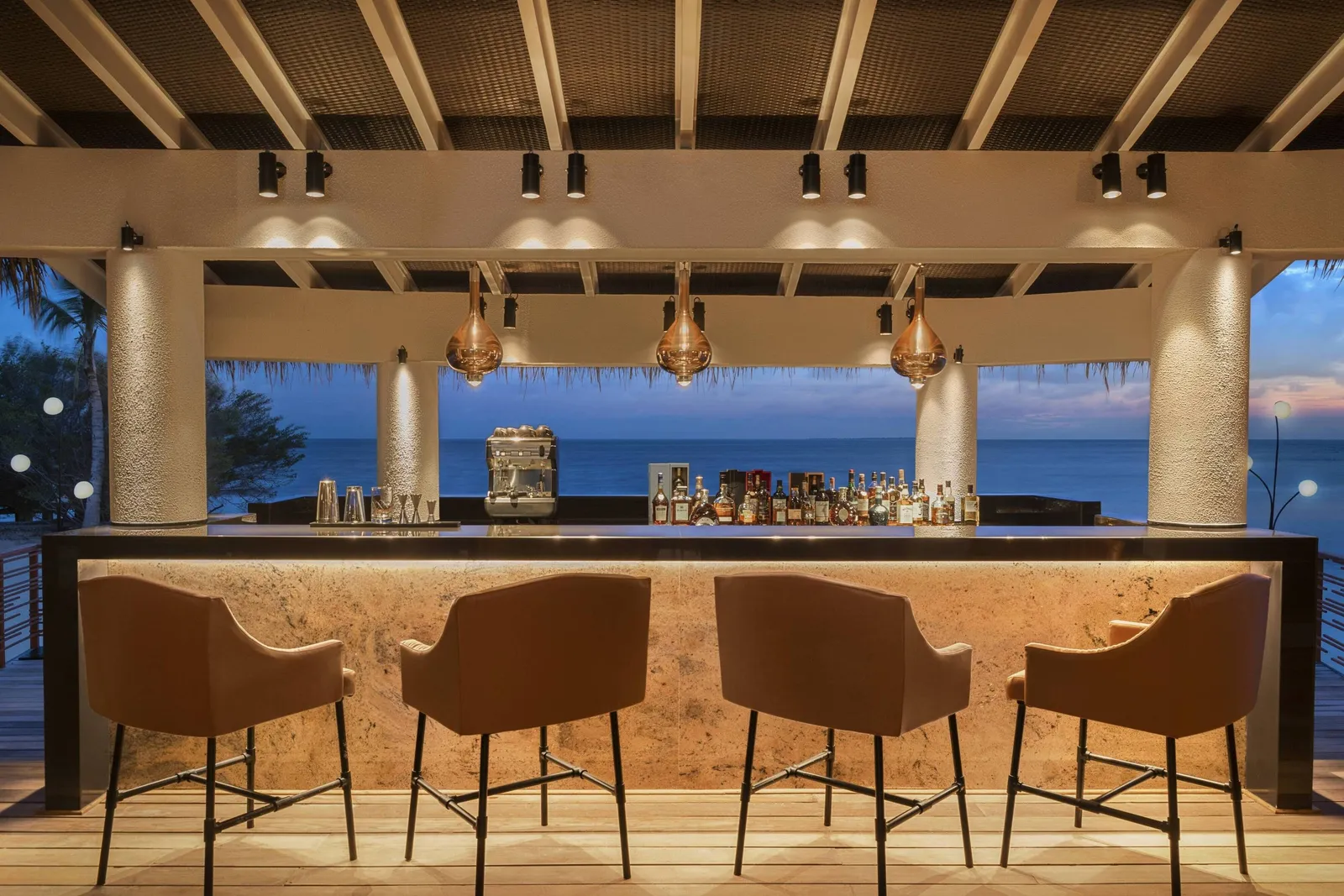 Wabi Sabi’s counter open to the sea, its stools in a row