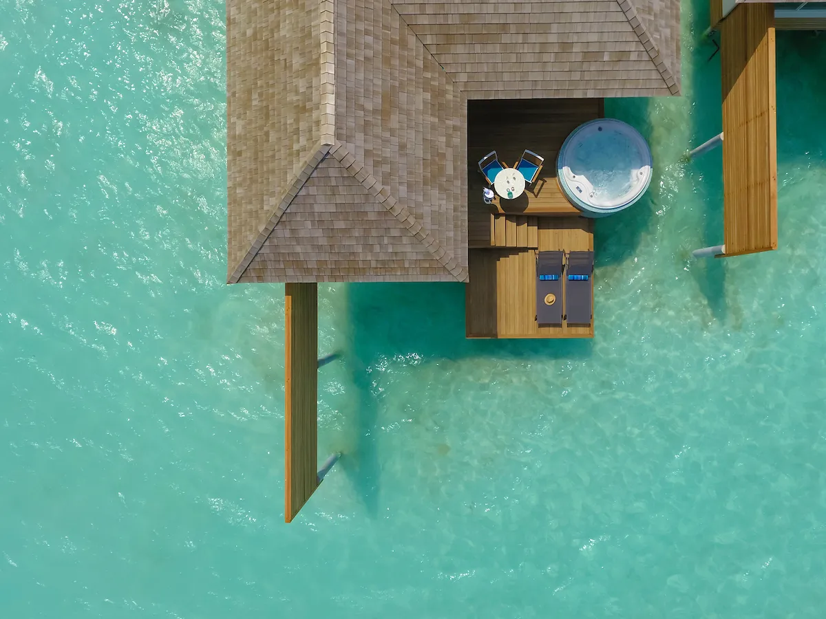 An Aqua Villa seen from above on the turquoise lagoon