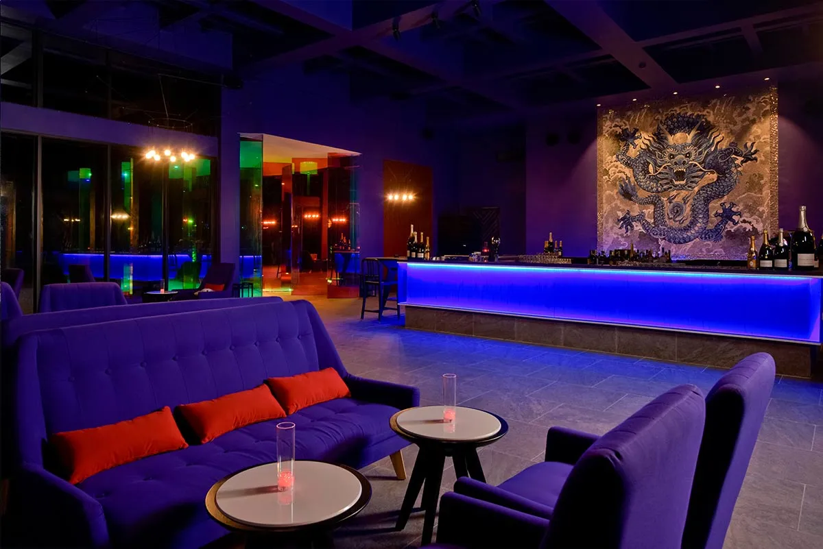 The Forbidden Bar, with purple sofas and blue lights