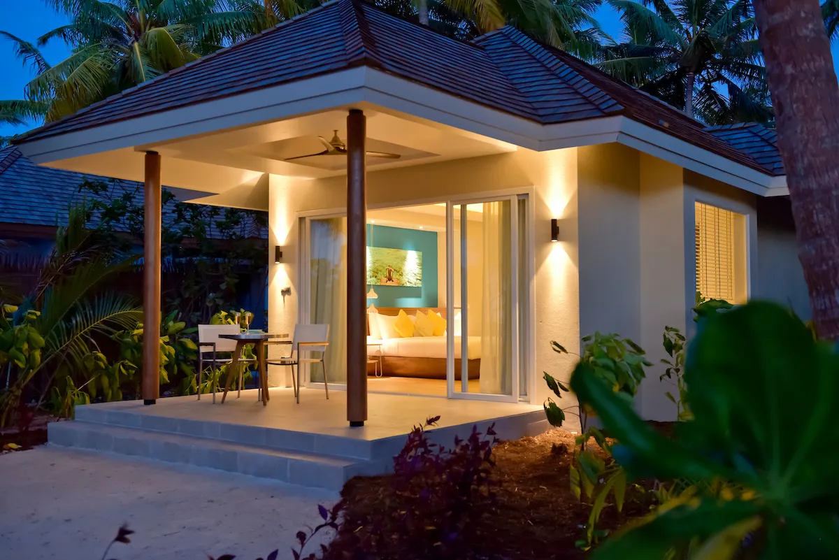 A Beach Villa with Swirl Pool in the evening, its terrace lit