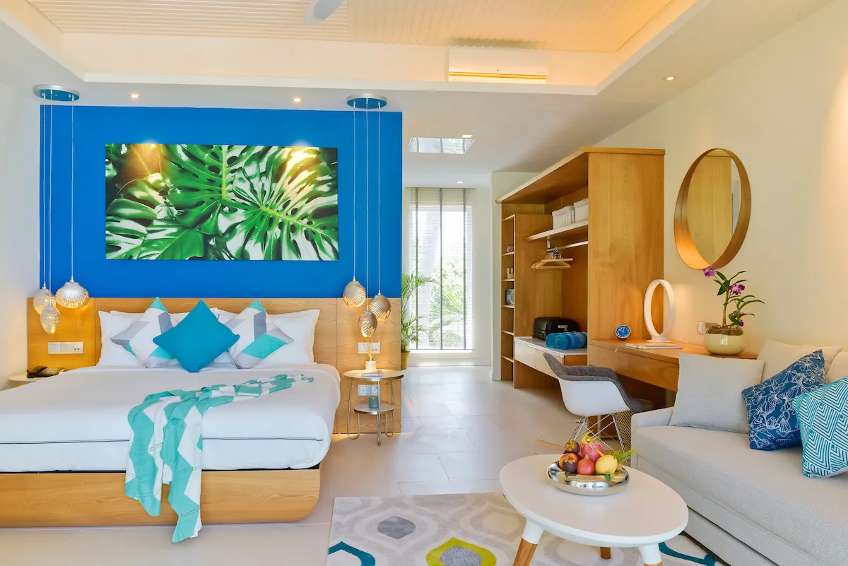 A first-floor Sky Studio, its bed and blue wall