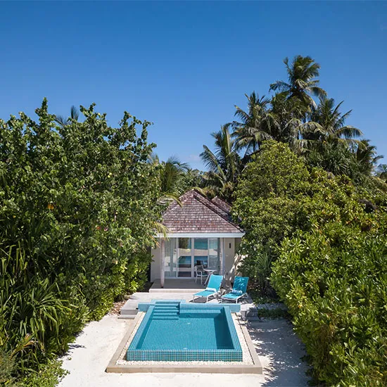 A Sunrise Beach Pool Villa with its pool in the garden
