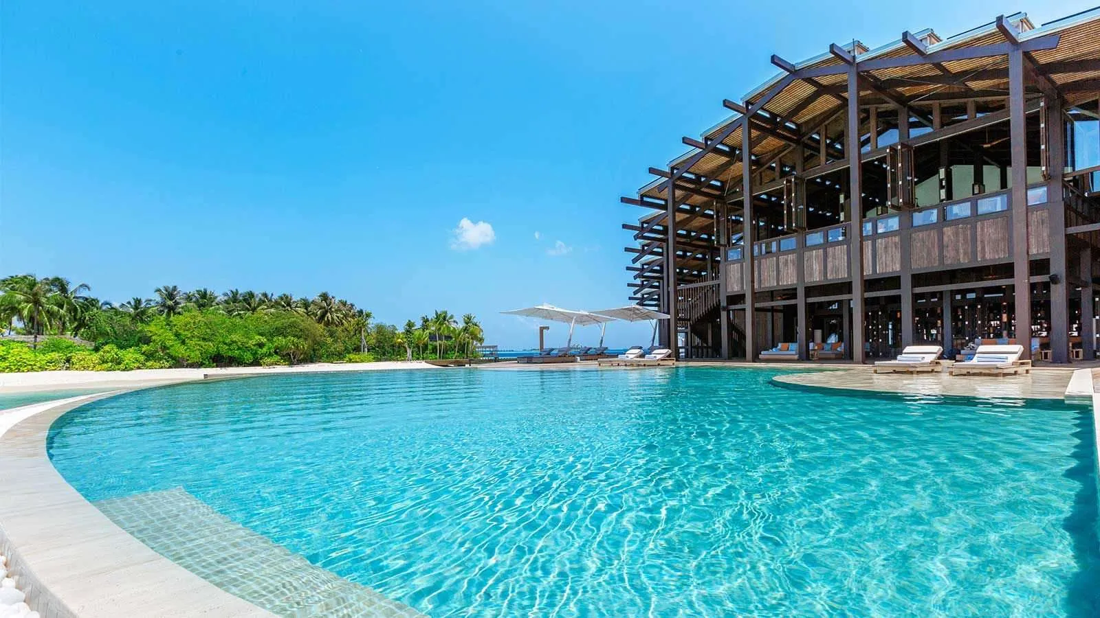 The Retreat pool and the timber building above the lagoon